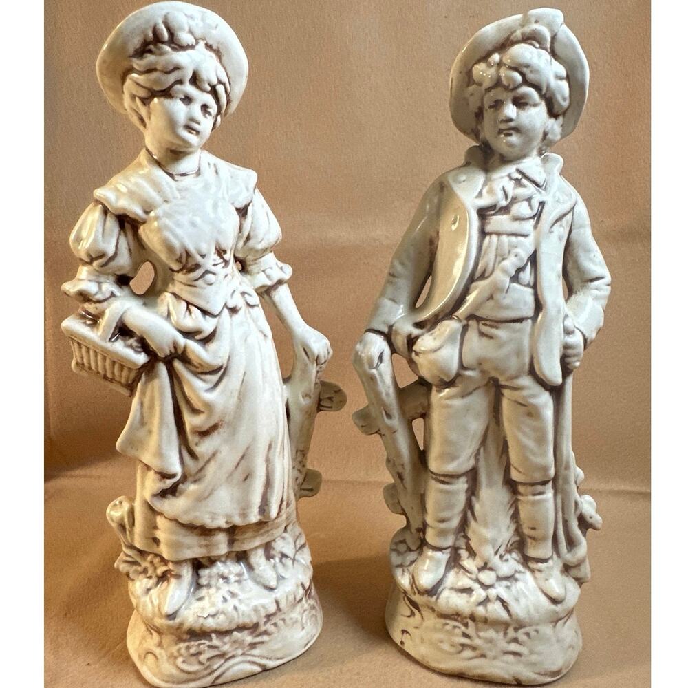 Vintage German porcelain bisque figurines boy & a girl in traditional clothing,